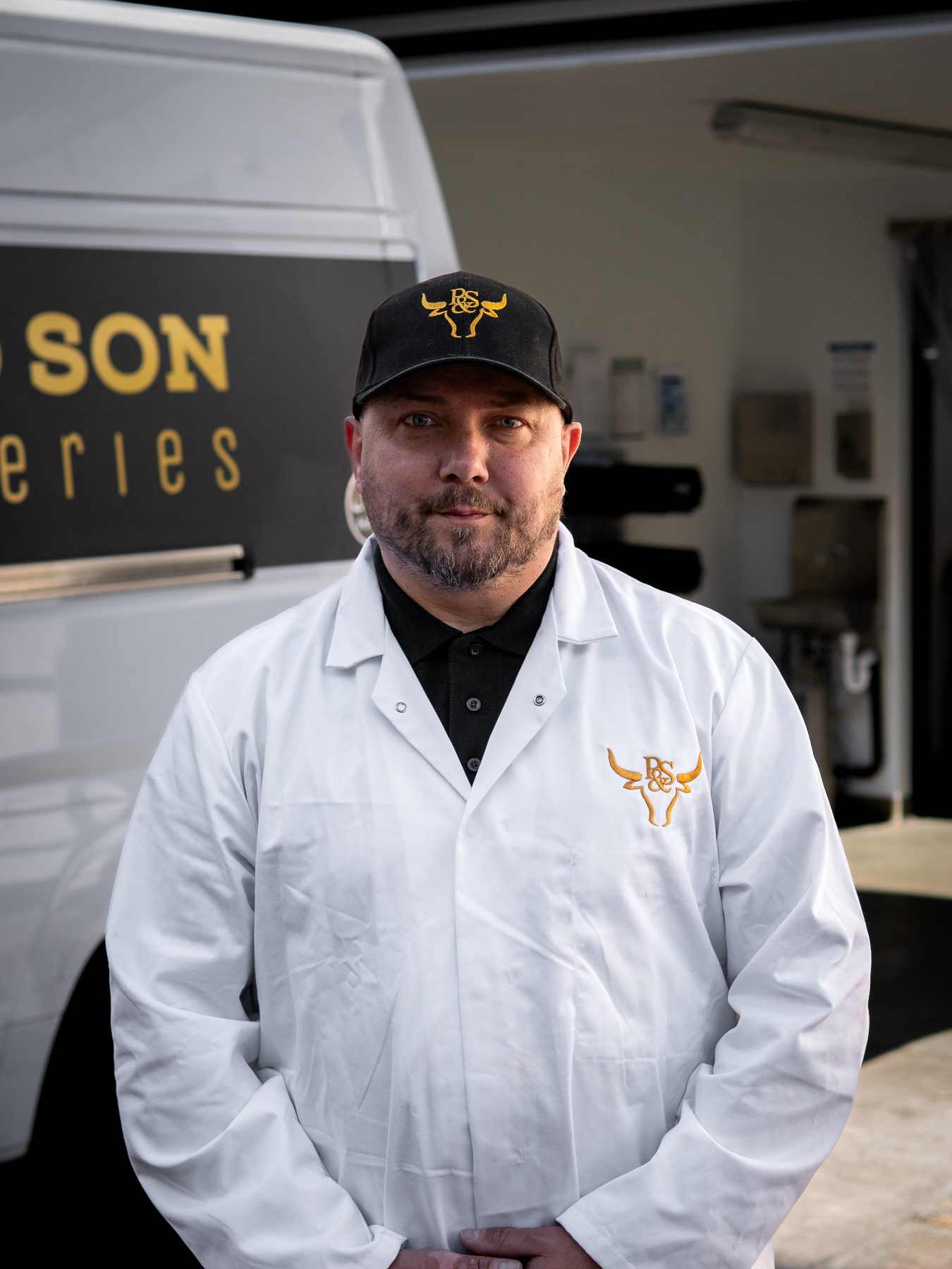 Peter, owner of Peter and Son, in front of the delivery van